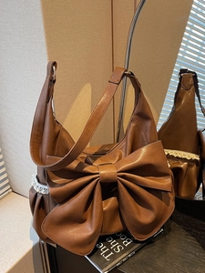 Retro dark brown tote bag with large bow detail and white lace trim on side pockets