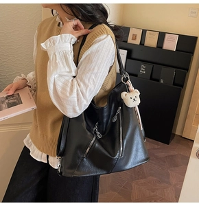 Black large capacity tote bag with silver zippers and a cute white bear pendant