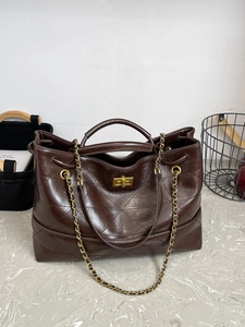 Vintage large brown quilted leather tote bag with chain strap and gold twist lock