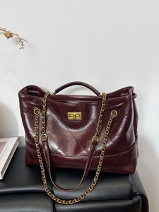 Retro burgundy quilted leather tote bag with gold chain strap and turn-lock closure