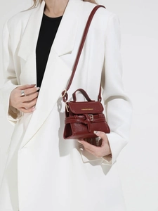 Deep red matte vintage crossbody bag with belt buckle and gold text detail for women