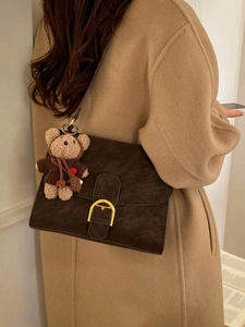 Elegant retro square saddle bag in dark brown suede with decorative bear charm