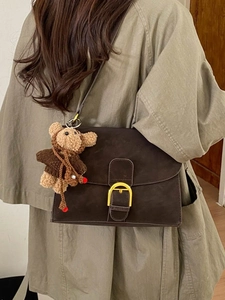 Vintage dark brown crossbody bag with gold horseshoe buckle and cute bear pendant