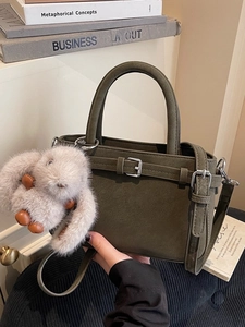 Deep olive green suede handbag with silver buckles and a cute plush rabbit keychain accessory