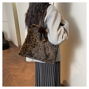 Close-up of leopard print faux fur tote bag with braided handles and wool coat styling