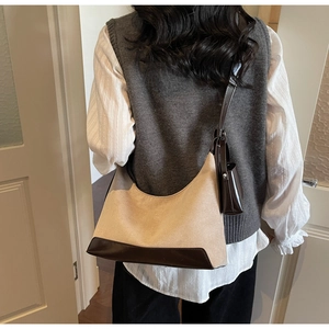 Detailed back view of a vintage large tote bag with matching mini pouch accessory
