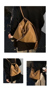 Detail of vintage brown leather tote bag with geometric fold design and contrast stitching