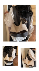 Detailed close-up of a vintage beige hobo bag with brown leather trim and mini pouch charm