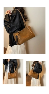 Detailed view of caramel faux leather tote bag featuring star charm and striped ribbon décor