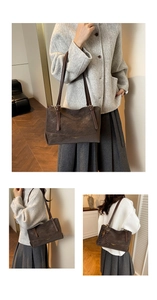 Detail of vintage brown leather tote bag with thin straps and gold logo on front