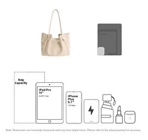 Detail view of large beige tote bag capacity showing 11-inch iPad and daily essentials