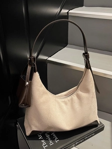 Minimalist beige suede hobo bag with brown leather trim and detachable coin purse