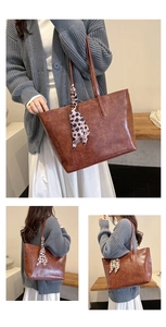 Detail of vintage brown tote bag featuring elegant leopard print scarf on the handle