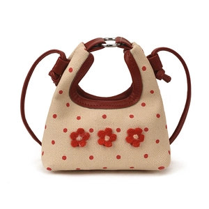 Mini handtas van canvas met rode stippen, bloemaccenten en schouderband