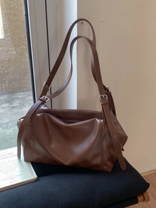 Retro brown faux leather shoulder tote bag with adjustable silver buckles and pillow shape