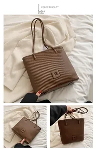Detailed views of coffee-colored pleated tote bag with square label and slim dual handles