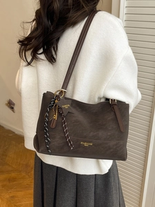 Retro large capacity dark brown tote bag with decorative charms and gold logo
