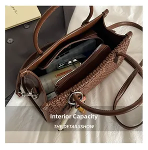 Detailed interior view of a brown woven tote bag showing its large storage capacity