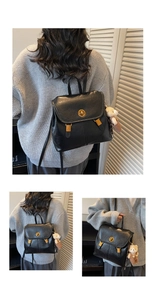 Detail of a vintage black PU leather backpack with a gold twist lock and a cute bear charm