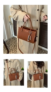 Detail of a brown woven bucket bag featuring multicolor wooden beads and a thin strap