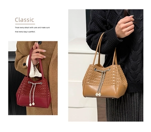 Detail of woven PU bucket bag featuring silver chain drawstring and pearl accents