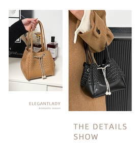 Detail of woven and leather bucket bag with pearl drawstring chain and contrast textures