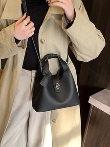 Chic black litchi pattern leather bucket handbag with silver lock and shoulder strap