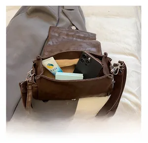 Interior view of the dark brown crossbody bag showing spacious capacity for daily essentials
