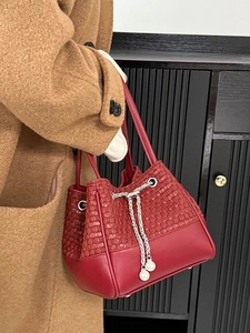 Deep red woven PU leather bucket bag with chain drawstring and pearl accents for women