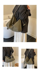 Detail of army green suede tote bag showing large capacity and soft minimalist design