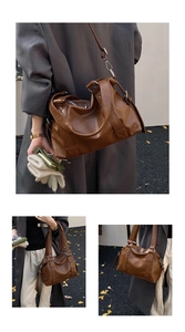 Detail of vintage brown tote bag with premium leather texture and stitching