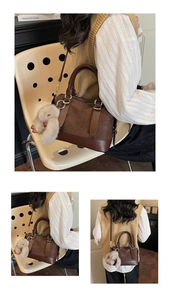 Detail of brown woven faux leather baguette bag with plush rabbit charm and gold ring buckle