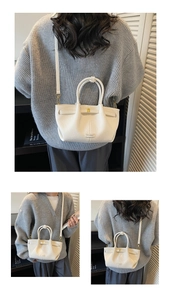Detail of white lychee pattern bucket bag with gold hardware and adjustable strap