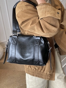 Retro black faux leather shoulder bag with pleated texture and silver metal hardware