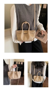 Three-way view of apricot bucket bag featuring litchi grain texture and gold hardware
