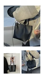 Detailed views of a black litchi grain tote bag shown in handheld and crossbody styles