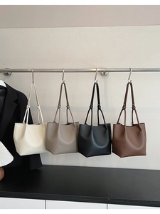 Litchi pattern bucket bags displayed in cream, taupe, black, and dark brown colors