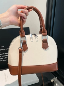 Elegant retro shell handbag in cream and brown contrast with detachable shoulder strap