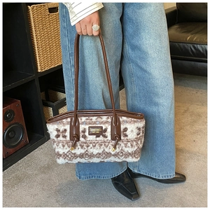 Detailed view of women's tote bag with snowflake pattern plush fabric and leather straps