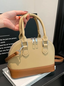 Two-tone retro shell handbag in beige and caramel brown with silver hardware detail
