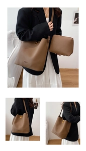 Detail of brown litchi pattern leather bucket bag set with metal twist lock and pouch