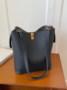 Retro black litchi texture leather bucket bag with gold lock and wide shoulder straps