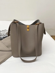 Elephant gray lychee grain leather bucket bag with gold lock and sleek shoulder strap