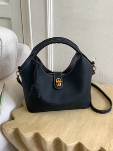 Chic black litchi grain leather bucket bag with gold lock and adjustable strap