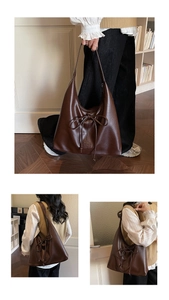Detailed view of dark brown oversized tote bag featuring decorative drawstring bow knot
