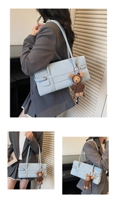 Light blue faux leather shoulder bag with a cute teddy bear plush charm detail
