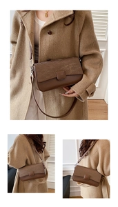 Detail view of brown crossbody bag with unique brushed texture and adjustable shoulder strap