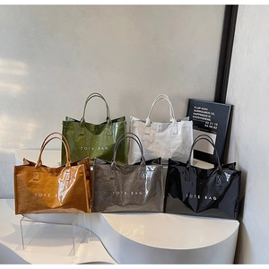 Group of large capacity tote bags in five colors with glossy wrinkled texture finish
