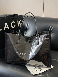 Glossy black large capacity tote bag with mirror finish and white TOTE BAG print