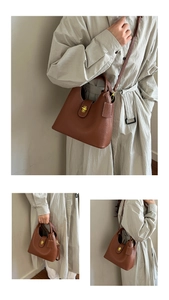 Detail of caramel lychee grain leather bucket bag with gold lock and adjustable strap